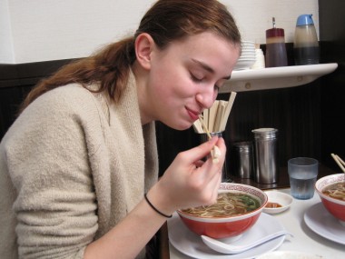 Hannah really liking the ramen.
