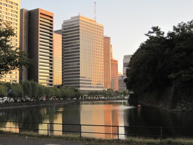 Modern buildings and old stone walls around the Imperial Palace park: one of the many sights of contrast in Japan.