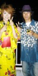 A woman in a yukata, light summertime version of the kimono, and a man with that style of shirt at a fireworks festival in Osaka.