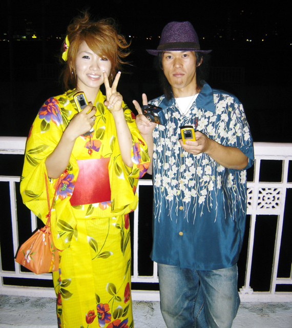 Eli Gerzon's Worldschooler Blog » A woman in a yukata, light summertime  version of the kimono, and a man with that style of shirt at a fireworks  festival in Osaka.