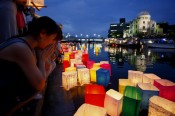 Memorial Service in Hiroshima, Japan with floating lanterns on the river in front of the A-Bomb on the anniversary of the dropping of the atomic bomb.