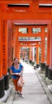 Lauren underneath one of the many gates or “torii” at the Fushimi Inari Taishi Shinto shrine in Kyoto, Japan. This is the main shrine to the “inari” god or “kami”: a fox god devoted to rice, business, and wealth. Each gate is donated by a different business or group of businesses.
